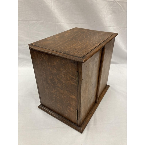 280A - AN OAK SMOKERS CABINET WITH THREE ENCLOSED DRAWERS H: 30CM, W: 32CM