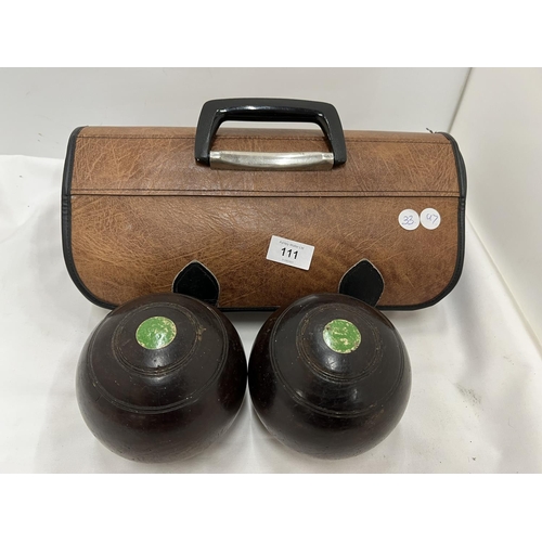 111 - A PAIR OF J B YOUNG WOODEN BOWLS IN A CASE