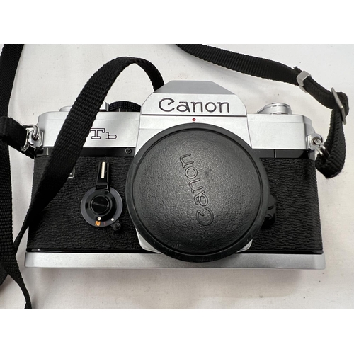 121 - A CANON FTb QL CAMERA WITH INSTRUCTIONS