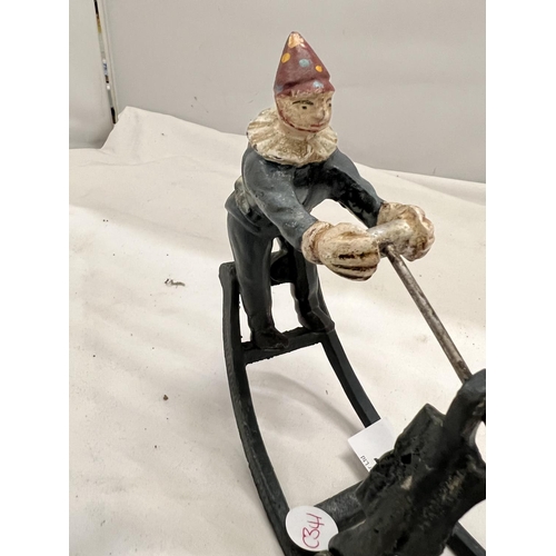 127 - A CAST MODEL OF CLOWNS ON A SEE-SAW