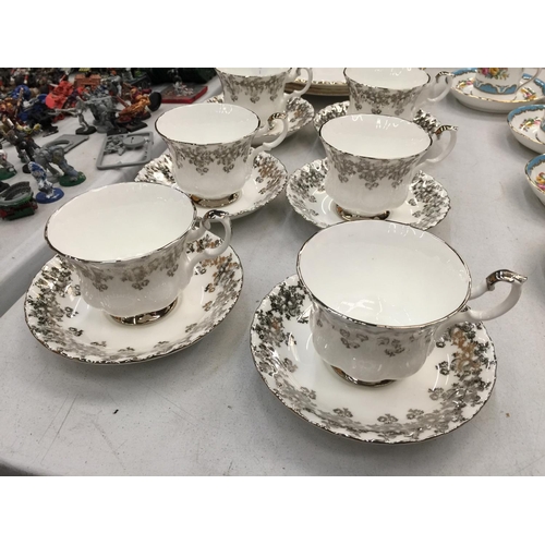 150 - A QUANTITY OF ROYAL ALBERT CHINA TO INCLUDE WHITE AND SILVER GILD CUPS AND SAUCERS AND TWO 'DIMITY R... 