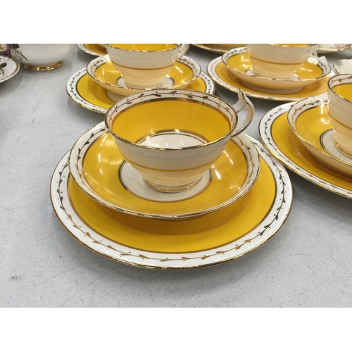 155 - A QUANTITY OF WETLEY CHINA CUPS, SAUCERS AND PLATES IN A VIBRANT YELLOW AND GUILD COLOUR