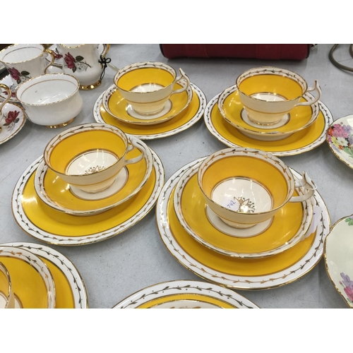 155 - A QUANTITY OF WETLEY CHINA CUPS, SAUCERS AND PLATES IN A VIBRANT YELLOW AND GUILD COLOUR