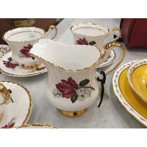 157 - A VINTAGE ROSE PATTERNED 'LUBORN' TEASET TO INCLUDE CUPS, SAUCERS, CREAM JUG AND SUGAR BOWL