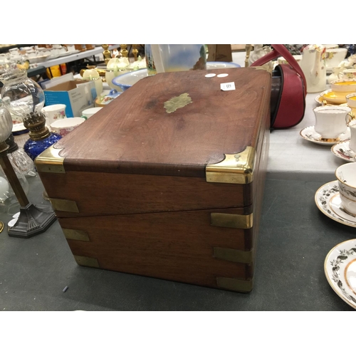 159 - A MAHOGANY WRITING SLOPE WITH BRASS DECORATION - IN NEED OF RESTORATION