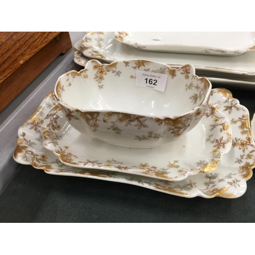 162 - A QUANTITY OF 'HAVILAND & CO' LIMOGES DINNERWARE INCLUDING SERVING PLATES, A SAUCE BOAT, ETC