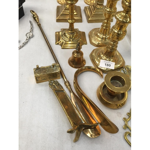 180 - A QUANTITY OF BRASSWARE TO INCLUDE CANDLESTICKS, ETCHED VASES, SHOE HORNS, ETC