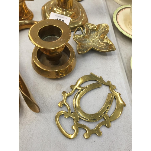 180 - A QUANTITY OF BRASSWARE TO INCLUDE CANDLESTICKS, ETCHED VASES, SHOE HORNS, ETC