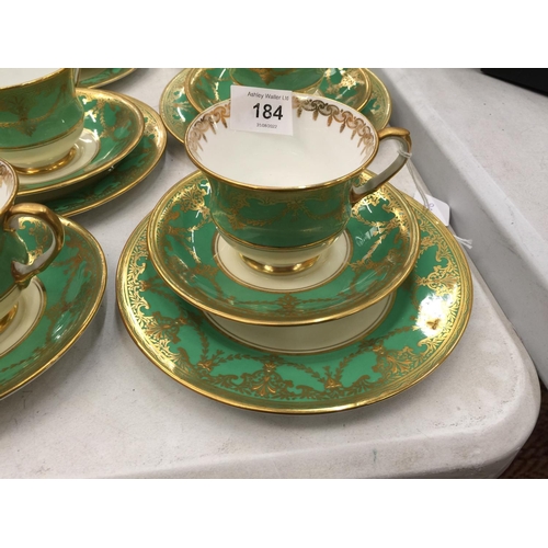 184 - FIVE AYNSLEY GREEN AND GILT TRIOS PLUS A CUPA AND SAUCER