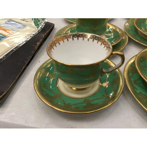 184 - FIVE AYNSLEY GREEN AND GILT TRIOS PLUS A CUPA AND SAUCER