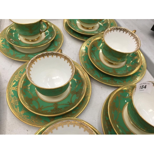 184 - FIVE AYNSLEY GREEN AND GILT TRIOS PLUS A CUPA AND SAUCER