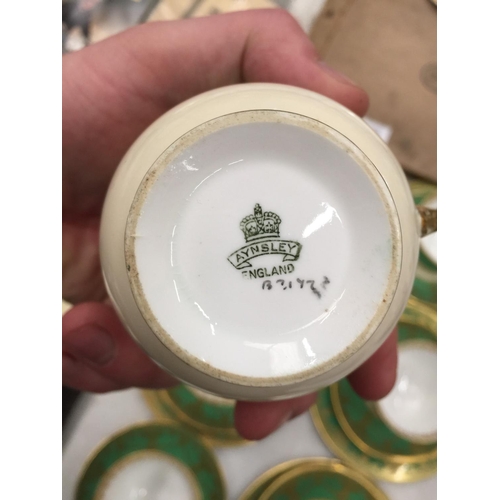 184 - FIVE AYNSLEY GREEN AND GILT TRIOS PLUS A CUPA AND SAUCER