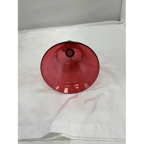 81 - A CRANBERRY COLOURED GLASS BELL HEIGHT 26CM