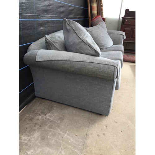 2567 - A PAIR OF MODERN GREY TWO SEATER SETTEES WITH TWELVE LOOSE CUSHIONS AND ANTIMACASSARS