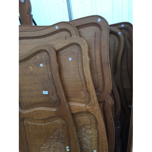 2563 - A COLLECTION OF CONTINENTAL OAK BEDSTEADS