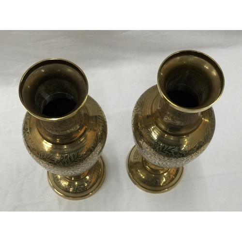 15 - A PAIR OF HEAVY BRASS INDIAN STYLE VASES WITH ETCHED FLORAL LEAF DESIGN H: 45CM