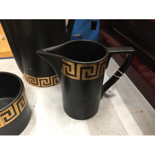 25 - A PORTMEIRION POTTERY GREEK KEY COFFEE SET IN BLACK AND GOLD WITH BLUE LABEL INDICATING DESIGNED BY ... 