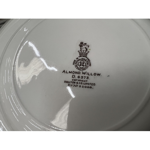 56 - A ROYAL DOULTON 'ALMOND WILLOW' REG NO. 6373 DINNER SERVICE TO INCLUDE PLATES, TUREENS, DESSERT BOWL... 