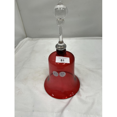 81 - A CRANBERRY COLOURED GLASS BELL HEIGHT 26CM