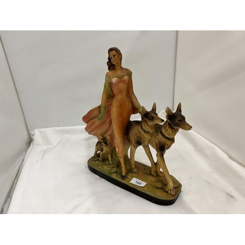 109 - AN EARLY 20TH CENTURY ART DECO STYLE CHALKWARE FIGURE OF A LADY AND TWO GERMAN SHEPHERDS MARKED RD 8... 