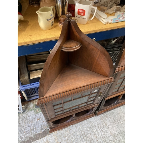 279A - A PAIR OF EDWARDIAN MAHOGANY ASTRAGAL GLAZED CORNER CABINETS WITH CARVED ARCHED TOPS AND LOCKING KEY... 