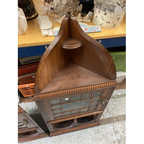 279A - A PAIR OF EDWARDIAN MAHOGANY ASTRAGAL GLAZED CORNER CABINETS WITH CARVED ARCHED TOPS AND LOCKING KEY... 