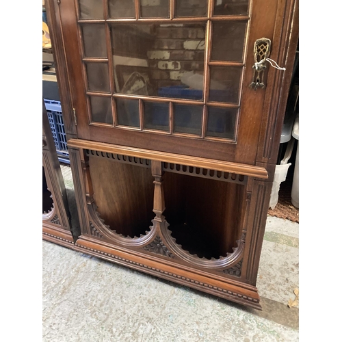 279A - A PAIR OF EDWARDIAN MAHOGANY ASTRAGAL GLAZED CORNER CABINETS WITH CARVED ARCHED TOPS AND LOCKING KEY... 