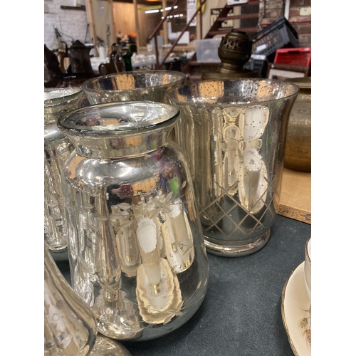 297 - A QUANTITY OF SILVER COLOURED CANDLESTICKS - 11 IN TOTAL PLUS FOUR SILVER COLOURED GLASS VASES