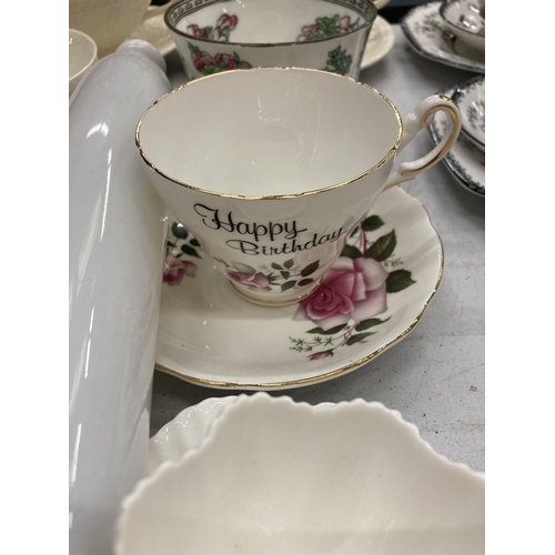 312 - A QUANTITY OF WEDGWOOD EMBOSSED CREAM TWO HANDLED SOUP BOWLS WITH SAUCERS, EGG CUPS, CHINA CUPS, ETC