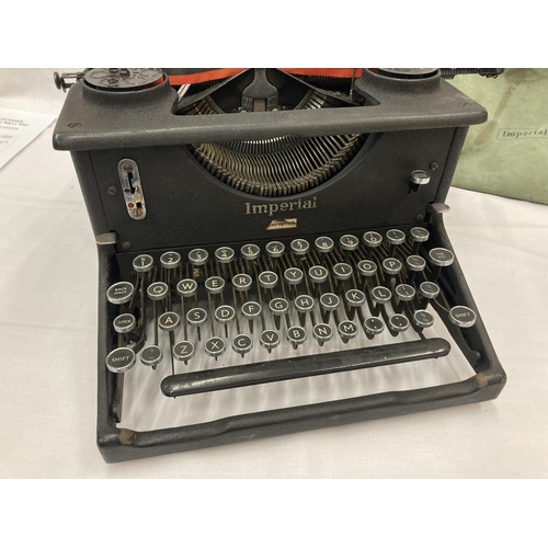 472A - A VINTAGE IMPERIAL TYPEWRITER WITH DUST COVER