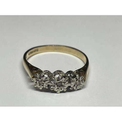 502 - A 9 CARAT GOLD RING WITH THREE IN LINE DIAMONDS SIZE P