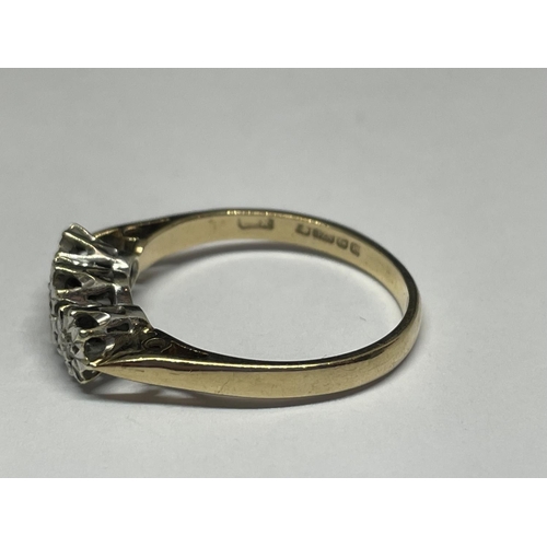 502 - A 9 CARAT GOLD RING WITH THREE IN LINE DIAMONDS SIZE P