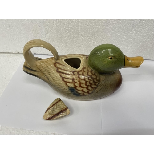 724 - TWO TONY WOOD TEAPOTS TO INCLUDE A DUCK (LID A/F) AND A DRAGON