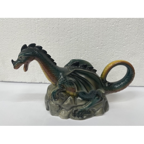 724 - TWO TONY WOOD TEAPOTS TO INCLUDE A DUCK (LID A/F) AND A DRAGON