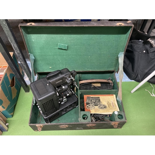 838A - A VINTAGE DITMAR FILM PROJECTOR IN A CASE WITH INSTRUCTIONS AND ANCILLARIES