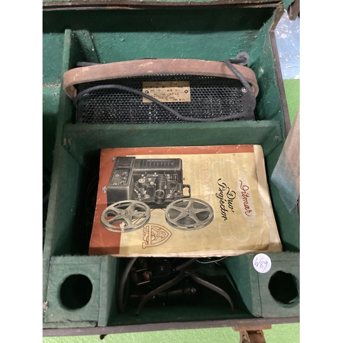 838A - A VINTAGE DITMAR FILM PROJECTOR IN A CASE WITH INSTRUCTIONS AND ANCILLARIES