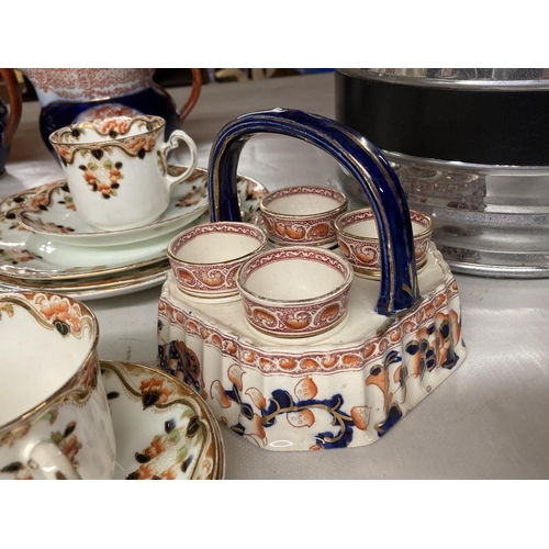 859 - A QUANTITY OF OSBOURNE CHINA TO INCLUDE CUPS, SAUCERS, SIDE PLATES, EGG CUPS IN A STAND PLUS TWO RID... 