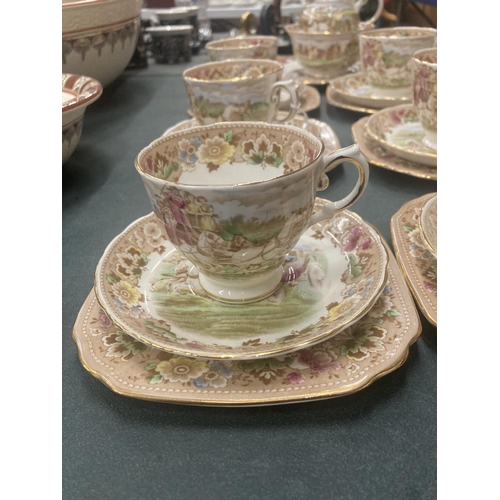 51 - A TUSCAN TEASET WITH A COACHING SCENE DESIGN TO INCLUDE A CAKE PLATE, CREAM JUG, SUGAR BOWL, CUPS, S... 