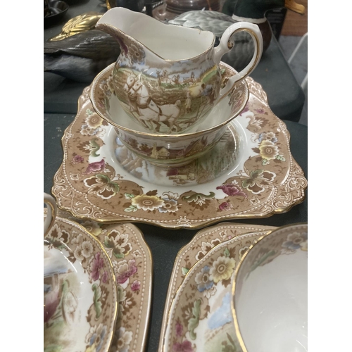 51 - A TUSCAN TEASET WITH A COACHING SCENE DESIGN TO INCLUDE A CAKE PLATE, CREAM JUG, SUGAR BOWL, CUPS, S... 