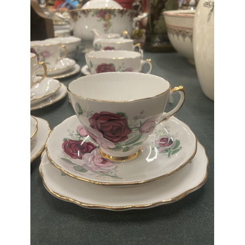 54 - A CROWN REGENT PART TEASET WITH ROSES DESIGN AND GILT AROUND THE RIMS AND HANDLES TO INCLUDE CREAM J... 