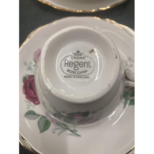 54 - A CROWN REGENT PART TEASET WITH ROSES DESIGN AND GILT AROUND THE RIMS AND HANDLES TO INCLUDE CREAM J... 