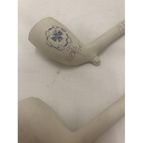 57 - FOUR CLAY PIPES