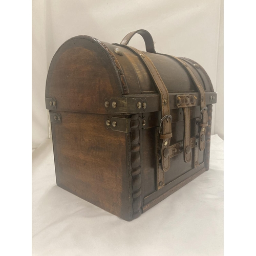 60 - A WOODEN DOMED CASE WITH LEATHER STRAPS 29CM WIDTH, HEIGHT 27CM DEPTH 20CM