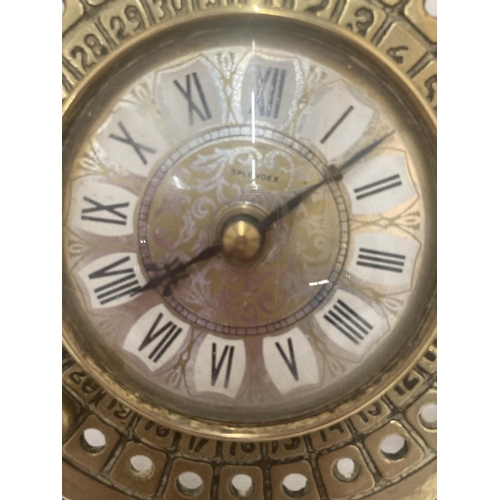 61 - A VINTAGE STYLE BRASS CLOCK WITH ROMAN NUMERALS 14.5CM X 12CM