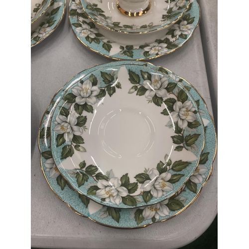 82 - A GLADSTONE 'MONTROSE' CHINA TEASET WITH A FLORAL DESIGN TO INCLUDE CAKE PLATE, SANDWICH TRAY, CREAM... 