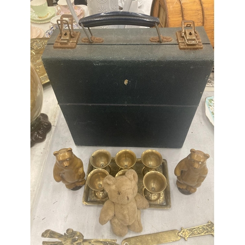 84 - A VINTAGE BLUE CASE TO INCLUDE A BRASS TRAY CONTAINING SIX SMALL GOBLETS, HORSE PLAQUE, CARVED WOODE... 