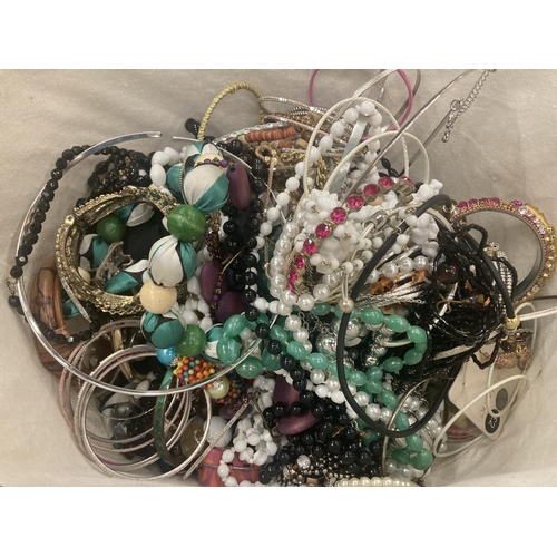 117 - A WIRE BASKET CONTAINING A LARGE QUANTITY OF COSTUME JEWELLERY TO INCLUDE BEADS, NECKLACES, BANGLES,... 