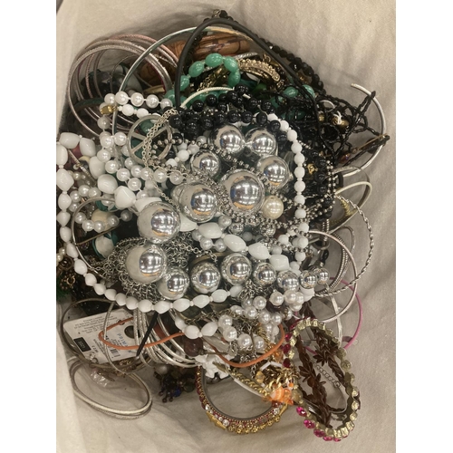 117 - A WIRE BASKET CONTAINING A LARGE QUANTITY OF COSTUME JEWELLERY TO INCLUDE BEADS, NECKLACES, BANGLES,... 