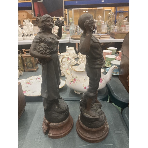 124 - TWO METAL SCULPTURES ON BASES OF A COUPLE GATHERING FLOWERS HEIGHT APPROX 33CM