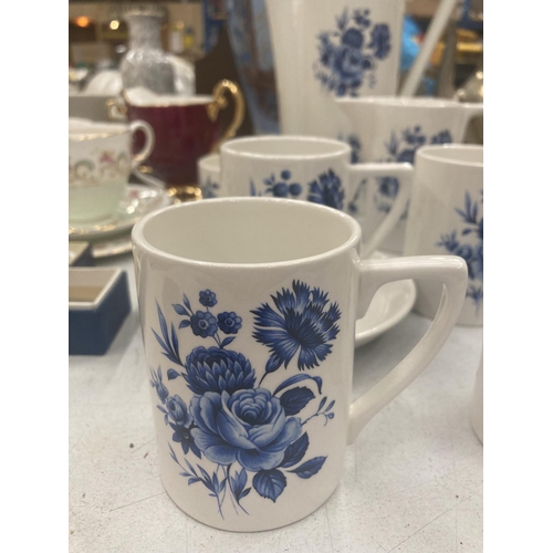 139 - A PORTMEIRION PART COFFEE SET IN WHITE WITH A BLUE FLORAL PATTERN TO INCLUDE A COFFEE POT, CREAM JUG... 